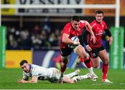 11 December 2021; James Hume of Ulster evades the tackle of JJ Hanrahan of Clermont Auvergne during the Heineken Champions Cup Pool A match between ASM Clermont Auvergne and Ulster at Stade Marcel-Michelin in Clermont-Ferrand, France. Photo by Julien Poupart/Sportsfile