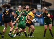 11 December 2021; Chanice Dolan of TG4 Underdogs in action against Megan Thyme, left, and Emma White of Meath during the match between Meath and TG4 Underdogs at Donaghmore Ashbourne GAA club in Ashbourne, Meath. Photo by David Fitzgerald/Sportsfile
