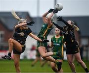 11 December 2021; Emma White of Meath in action against Laura Basquel, left, and Anna Murphy of TG4 Underdogs during the match between Meath and TG4 Underdogs at Donaghmore Ashbourne GAA club in Ashbourne, Meath. Photo by David Fitzgerald/Sportsfile