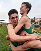 12 December 2021; Darragh McElhinney of Ireland celebrates with Keelan Kilrehill, bottom, and Michael Power after competing in the U23 Men's 8000m during the SPAR European Cross Country Championships Fingal-Dublin 2021 at the Sport Ireland Campus in Dublin. Photo by Sam Barnes/Sportsfile