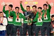 12 December 2021; Team Ireland, from left, Thomas Devaney, Darragh McElhinney, Keelan Kilrehill, Donal Devane, Jamie Battle, and Michael Power celebrate with their gold medals during the medal ceremony for the U23 Men's team event at the SPAR European Cross Country Championships Fingal-Dublin 2021 at the Sport Ireland Campus in Dublin. Photo by Sam Barnes/Sportsfile