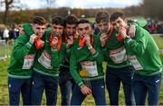 12 December 2021; Team Ireland, from left, Jamie Battle, Darragh McElhinney, Michael Power, Keelan Kilrehill, Donal Devane and Thomas Devaney celebrate with their gold medals after the medal ceremony for the U23 Men's team event during the SPAR European Cross Country Championships Fingal-Dublin 2021 at the Sport Ireland Campus in Dublin. Photo by Ramsey Cardy/Sportsfile