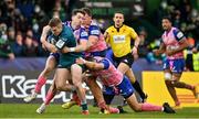 12 December 2021; Conor Fitzgerald of Connacht is tackled by Paul Champ and Ngani Laumape of Stade Francais during the Heineken Champions Cup Pool B match between Connacht and Stade Francais Paris at Sportsground in Galway. Photo by Brendan Moran/Sportsfile