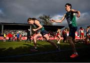 12 December 2021; Luke McCann, right, passes the baton to Síofra Cléirigh Büttner of Ireland in the Mixed Relay final during the SPAR European Cross Country Championships Fingal-Dublin 2021 at the Sport Ireland Campus in Dublin. Photo by Ramsey Cardy/Sportsfile