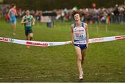 12 December 2021; Charles Hicks of Great Britain crosses the finish line to win the U23 Men's 8000m during the SPAR European Cross Country Championships Fingal-Dublin 2021 at the Sport Ireland Campus in Dublin. Photo by Ramsey Cardy/Sportsfile