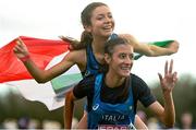 12 December 2021; Nadia Battocletti of Italy celebrates with team-mate Anna Arnaudo, top, after winning the U23 Women's 6000m during the SPAR European Cross Country Championships Fingal-Dublin 2021 at the Sport Ireland Campus in Dublin.  Photo by Ramsey Cardy/Sportsfile