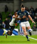 11 December 2021; James Lowe of Leinster is tackled by Semesa Rokoduguni of Bath during the Heineken Champions Cup Pool A match between Leinster and Bath at Aviva Stadium in Dublin. Photo by Harry Murphy/Sportsfile