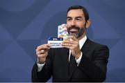 16 December 2021; Special guest Robert Pirès draws out the card of Republic of Ireland during the UEFA Nations League 2022/23 League Phase Draw at the UEFA headquarters, The House of European Football in Nyon, Switzerland. Photo by Richard Juilliart / UEFA via Sportsfile