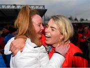 18 December 2021; Ursula Jacob of Oulart the Ballagh celebrates with a supporter after the 2020 AIB All-Ireland Senior Club Camogie Championship Final match between Sarsfields and Oulart the Ballagh at UMPC Nowlan Park, Kilkenny. Photo by Eóin Noonan/Sportsfile