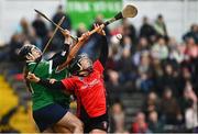 18 December 2021; Una Leacy of Oulart the Ballagh is tackled by Sarsfields goalkeeper Laura Glynn during the 2020 AIB All-Ireland Senior Club Camogie Championship Final match between Sarsfields and Oulart the Ballagh at UMPC Nowlan Park, Kilkenny. Photo by Eóin Noonan/Sportsfile