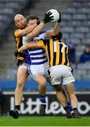 18 December 2021; Paul McDermott of Naas is tackled by Aidan Cash, left, and Andre O’Brien of Shelmaliers during the AIB Leinster GAA Football Senior Club Championship Semi-Final match between Shelmaliers and Naas at Croke Park in Dublin. Photo by Ray McManus/Sportsfile