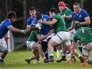 18 December 2021; David Odiase of Italy is tackled by Ben Popplewell, right, and Matthew Devine of Ireland during the U20's International match between Ireland and Italy at UCD Bowl in Dublin. Photo by Piaras Ó Mídheach/Sportsfile