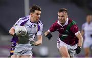 18 December 2021; Dara Mullin of Kilmacud Crokes is tackled by Alex Mohan of Portarlington during the AIB Leinster GAA Football Senior Club Championship Semi-Final match between Portarlington and Kilmacud Crokes at Croke Park in Dublin. Photo by Ray McManus/Sportsfile