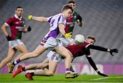 18 December 2021; Cian O’Connor of Kilmacud Crokes shoots to score his side's first goal, despite pressure from Portarlington's Cathal Bennett, during the AIB Leinster GAA Football Senior Club Championship Semi-Final match between Portarlington and Kilmacud Crokes at Croke Park in Dublin. Photo by Seb Daly/Sportsfile