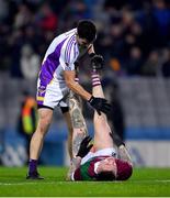 18 December 2021; Rory O’Carroll of Kilmacud Crokes assists Stuart Mulpeter of Portarlington after the AIB Leinster GAA Football Senior Club Championship Semi-Final match between Portarlington and Kilmacud Crokes at Croke Park in Dublin. Photo by Ray McManus/Sportsfile