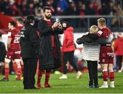 18 December 2021; Jean Kleyn of Munster takes a photo for a young supporter who ran onto the pitch to greet Craig Casey after the Heineken Champions Cup Pool B match between Munster and Castres Olympique at Thomond Park in Limerick. Photo by David Fitzgerald/Sportsfile