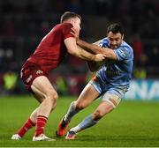 18 December 2021; Thomas Combezou of Castres Olympique is tackled by Chris Farrell of Munster during the Heineken Champions Cup Pool B match between Munster and Castres Olympique at Thomond Park in Limerick. Photo by Brendan Moran/Sportsfile