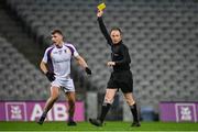 18 December 2021; Referee John Hickey shows a yellow card to Callum Pearson of Kilmacud Crokes during the AIB Leinster GAA Football Senior Club Championship Semi-Final match between Portarlington and Kilmacud Crokes at Croke Park in Dublin. Photo by Seb Daly/Sportsfile