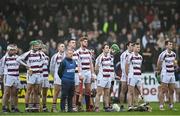 19 December 2021; The Slaughtneil team and manager Michael McShane during the playing of the National Anthem prior to the AIB Ulster GAA Hurling Senior Club Championship Final match between Ballycran and Slaughtneil at Corrigan Park in Belfast. Photo by Ramsey Cardy/Sportsfile