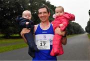 19 December 2021; Brendan Boyce of Finn Valley AC celebrates with his 10 month old twins Thomas, left, Isabelle after finishing second in the Senior Men’s 35k Walk at the Irish Life Health National 35km Race Walks Championship at Saint Anne's Park in Raheny, Dublin. Photo by Seb Daly/Sportsfile