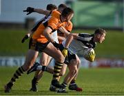 19 December 2021; Brian O’Sullivan of Newcastlewest is tackled by Greg Horan of Austin Stacks during the AIB Munster GAA Football Senior Club Football Championship Semi-Final match between Austin Stacks and Newcastle West at Austin Stack Park in Tralee, Kerry. Photo by Brendan Moran/Sportsfile
