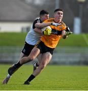 19 December 2021; Joseph O'Connor of Austin Stacks is tackled by Iain Corbett of Newcastlewest during the AIB Munster GAA Football Senior Club Football Championship Semi-Final match between Austin Stacks and Newcastle West at Austin Stack Park in Tralee, Kerry. Photo by Brendan Moran/Sportsfile
