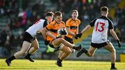 19 December 2021; Dylan Casey of Austin Stacks is tackled by Darren O’Doherty of Newcastlewest during the AIB Munster GAA Football Senior Club Football Championship Semi-Final match between Austin Stacks and Newcastle West at Austin Stack Park in Tralee, Kerry. Photo by Brendan Moran/Sportsfile