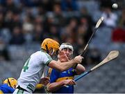 19 December 2021; Colin Fennelly of Shamrocks Ballyhale flicks the ball goalwards, under pressure from Eoin Doyle of Clough Ballacolla, 4, to score his side's third goal during the AIB Leinster GAA Hurling Senior Club Championship Final match between Clough Ballacolla and Shamrocks Ballyhale at Croke Park in Dublin. Photo by Piaras Ó Mídheach/Sportsfile