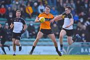 19 December 2021; Joseph O'Connor of Austin Stacks is tackled by Sean Murphy of Newcastlewest during the AIB Munster GAA Football Senior Club Football Championship Semi-Final match between Austin Stacks and Newcastle West at Austin Stack Park in Tralee, Kerry. Photo by Brendan Moran/Sportsfile