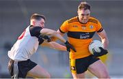 19 December 2021; Brendan O'Sullivan of Austin Stacks holds off the challenge of Lee Woulfe of Newcastlewest during the AIB Munster GAA Football Senior Club Football Championship Semi-Final match between Austin Stacks and Newcastle West at Austin Stack Park in Tralee, Kerry. Photo by Brendan Moran/Sportsfile