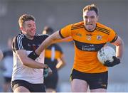 19 December 2021; Brendan O'Sullivan of Austin Stacks holds off the challenge of Donnchadh Woods of Newcastlewest during the AIB Munster GAA Football Senior Club Football Championship Semi-Final match between Austin Stacks and Newcastle West at Austin Stack Park in Tralee, Kerry. Photo by Brendan Moran/Sportsfile