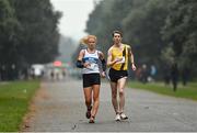 19 December 2021; Kate Veale of West Waterford AC, left, competing in the Senior Women’s 35k Walk, and Jonathan Hobbs of Great Britain competing in the Senior Men’s 35k Walk at the Irish Life Health National 35km Race Walks Championship at Saint Anne's Park in Raheny, Dublin. Photo by Seb Daly/Sportsfile