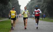 19 December 2021; Athletes from left, Joe Mooney of Adamstown AC, Agnieszka Ellward of Poland, and Jerome Caprice of Dundrum South Dublin AC competing in the Senior 35k Walk at the Irish Life Health National 35km Race Walks Championship at Saint Anne's Park in Raheny, Dublin. Photo by Seb Daly/Sportsfile