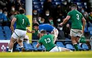 18 December 2021; Giacomo Ferrari of Italy is tackled by Fionn Gibbons of Ireland, 13, during the U20's International match between Ireland and Italy at UCD Bowl in Dublin. Photo by Piaras Ó Mídheach/Sportsfile