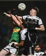 19 December 2021; Emmet Bradley of Glen contests a high ball late in the game against Ryan McEvoy, right, and Ceilum Doherty of Kilcoo during the AIB Ulster GAA Football Club Senior Championship Semi-Final match between Glen and Kilcoo at Athletic Grounds in Armagh. Photo by David Fitzgerald/Sportsfile