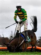 27 December 2021; Jockey Mark Walsh is unseated from Arctic Warrior during the Paddy Power Future Champions Novice Hurdle on day two of the Leopardstown Christmas Festival at Leopardstown Racecourse in Dublin. Photo by Eóin Noonan/Sportsfile