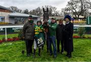 27 December 2021; Jockey Sean Flanagan, second from left, with trainer Noel Meade, left and spouse Derville Hoey, right, with winning connections after sending out School Boy Hours to win the Paddy Power Steeplechase on day two of the Leopardstown Christmas Festival at Leopardstown Racecourse in Dublin. Photo by Eóin Noonan/Sportsfile