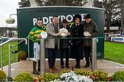 27 December 2021; Jockey Sean Flanagan, left, with trainer Noel Meade, right, and spouse Derville Hoey, with winning connections after sending out School Boy Hours to win the Paddy Power Steeplechase on day two of the Leopardstown Christmas Festival at Leopardstown Racecourse in Dublin. Photo by Eóin Noonan/Sportsfile