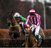 27 December 2021; School Boy Hours, left, with Sean Flanagan up, jumps the last on their way to winning the Paddy Power Steeplechase from second place Ben Dundee, with Ben Harvey up, day two of the Leopardstown Christmas Festival at Leopardstown Racecourse in Dublin. Photo by Eóin Noonan/Sportsfile