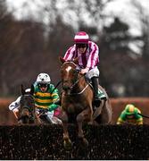 27 December 2021; School Boy Hours, left, with Sean Flanagan up, jumps the last on their way to winning the Paddy Power Steeplechase from second place Ben Dundee, with Ben Harvey up, day two of the Leopardstown Christmas Festival at Leopardstown Racecourse in Dublin. Photo by Eóin Noonan/Sportsfile