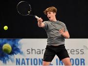 28 December 2021; Alex Garvin during his Boys U16 Singles Round of 32 match against Harry Scott during the Shared Access National Indoor Tennis Championships 2022 at David Lloyd Riverview in Dublin. Photo by Ramsey Cardy/Sportsfile