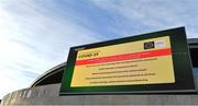 29 December 2021; Coronavirus COVID-19 public health advice is displayed on the big screen above the weigh room before racing on day four of the Leopardstown Christmas Festival at Leopardstown Racecourse in Dublin. Photo by Seb Daly/Sportsfile