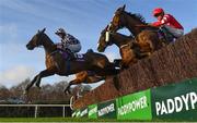 29 December 2021; Shes Some Doll, left, with Breen Kane up, and Golden Jewel, right, with Chris Timmons up, jump the last during the first circuit of the Adare Manor Opportunity Handicap Steeplechase on day four of the Leopardstown Christmas Festival at Leopardstown Racecourse in Dublin. Photo by Seb Daly/Sportsfile