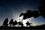 29 December 2021; A view of the field as they jump the fourth during the Pigsback.com Maiden Hurdle on day four of the Leopardstown Christmas Festival at Leopardstown Racecourse in Dublin. Photo by Seb Daly/Sportsfile