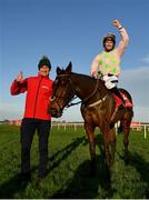 29 December 2021; Jockey Patrick Mullins and groom David Porter celebrate with Sharjah after winning the Matheson Hurdle, for a fourth time, on day four of the Leopardstown Christmas Festival at Leopardstown Racecourse in Dublin. Photo by Seb Daly/Sportsfile