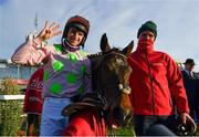 29 December 2021; Jockey Patrick Mullins and groom David Porter celebrate with Sharjah after winning the Matheson Hurdle, for a fourth time, on day four of the Leopardstown Christmas Festival at Leopardstown Racecourse in Dublin. Photo by Seb Daly/Sportsfile