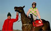 29 December 2021; Jockey Patrick Mullins and groom David Porter celebrate with Sharjah after winning the Matheson Hurdle, for a fourth time, on day four of the Leopardstown Christmas Festival at Leopardstown Racecourse in Dublin. Photo by Seb Daly/Sportsfile