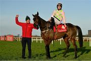 29 December 2021; Jockey Patrick Mullins and groom David Porter celebrate with Sharjah after winning the Matheson Hurdle, for a fourth time, on day four of the Leopardstown Christmas Festival at Leopardstown Racecourse in Dublin. Photo by Seb Daly/Sportsfile