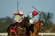 29 December 2021; Sharjah, left, with Patrick Mullins up, on their way to winning the Matheson Hurdle, from second place Zanahiyr, with Jack Kennedy up, on day four of the Leopardstown Christmas Festival at Leopardstown Racecourse in Dublin. Photo by Seb Daly/Sportsfile