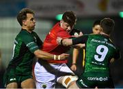 1 January 2022; Jack O’Donoghue of Munster is tackled by John Porch, left, and Kieran Marmion of Connacht during the United Rugby Championship match between Connacht and Munster at The Sportsground in Galway. Photo by Eóin Noonan/Sportsfile